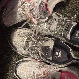 Avia White and Pink Athletic Shoes prices vary by charms and accessories
